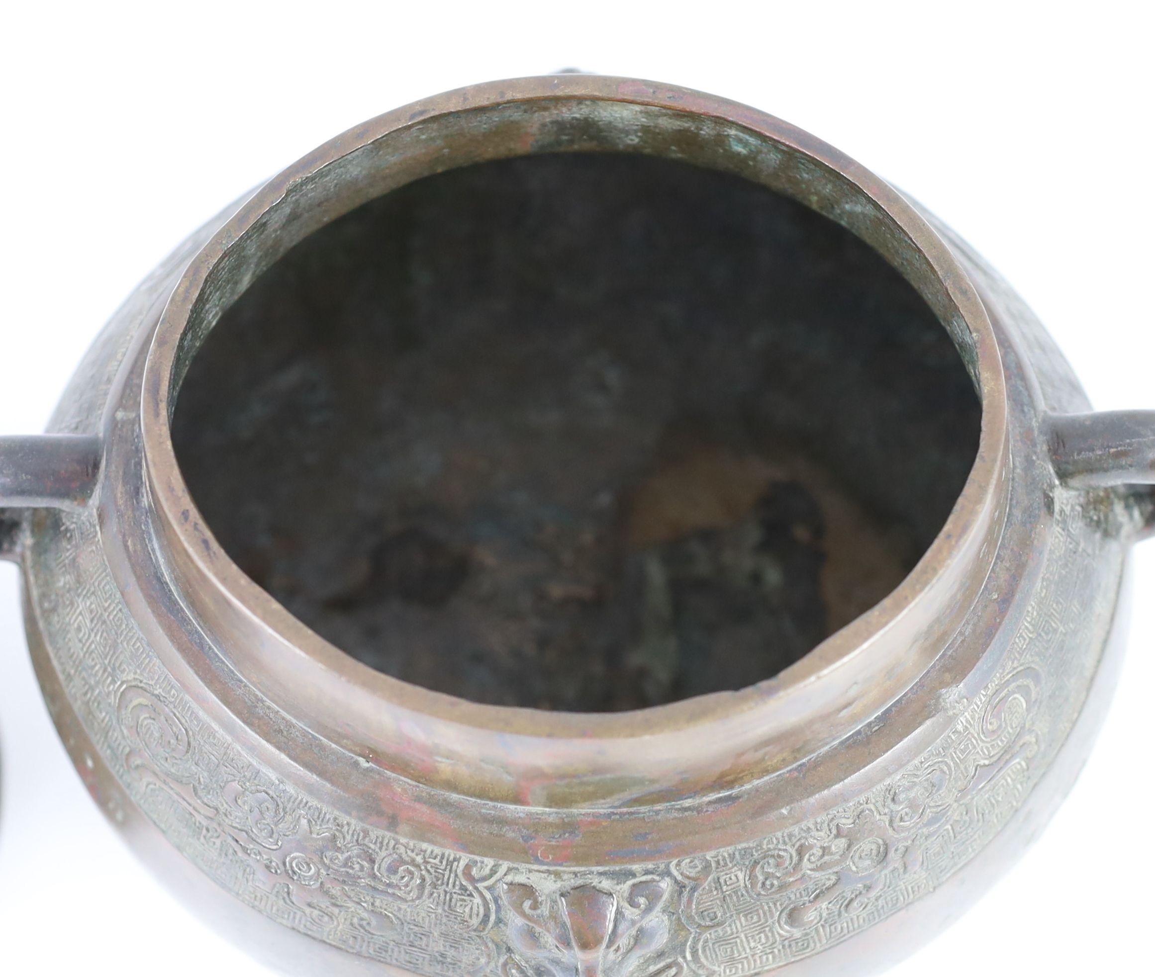 A Chinese Ming bronze jar and cover, hu, 26cm high, old repairs